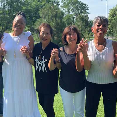 Four Lotus Network friends enjoying time outdoors